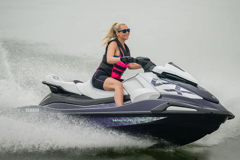 Slide: The Image of Manufacturer Provided Image: 2026 Yamaha WaveRunner VX Cruiser HO on water, rider wearing sunglasses and life vest. - 1