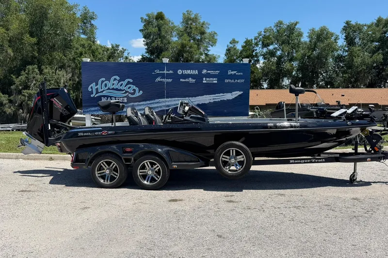 The Image of 2023 Ranger Z521R boat on trailer at Holiday Marine dealership. - 1