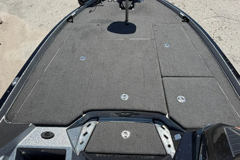 Slide: The Image of 2023 Ranger Z521R boat deck with carpeted surface and storage compartments. - 5