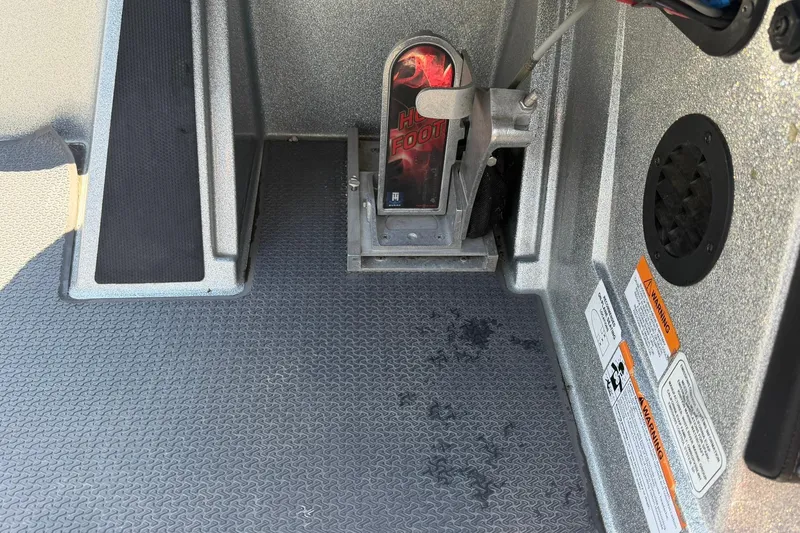 Slide: The Image of 2023 Ranger Z521R boat foot pedal and interior details. - 11