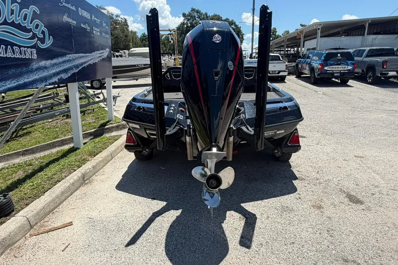 Slide: The Image of 2023 Ranger Z521R boat with powerful outboard motor, parked at a marina. - 17
