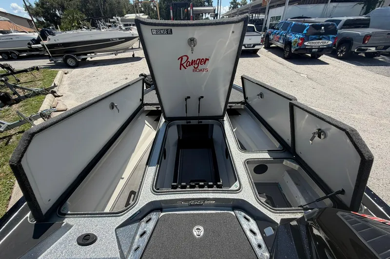 Slide: The Image of 2023 Ranger Z521R boat storage compartments open, showcasing spacious interior design. - 6