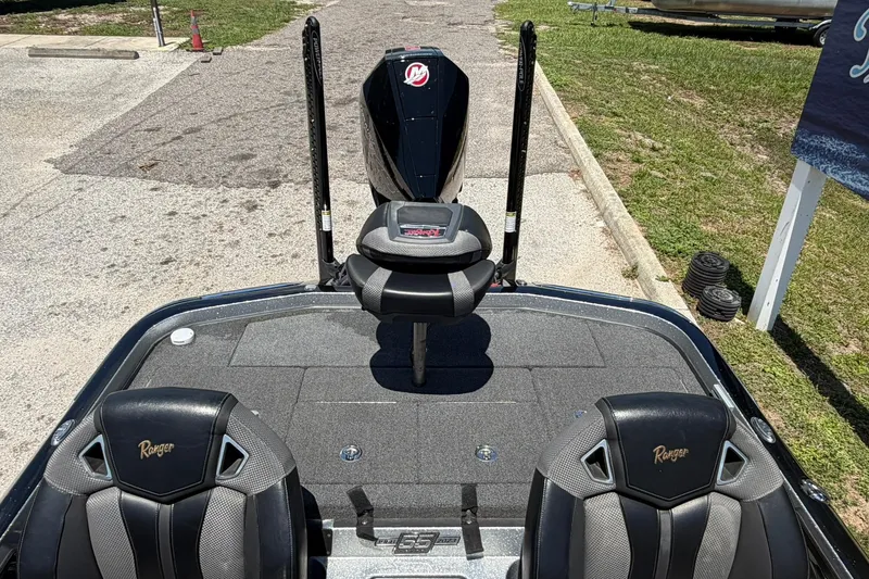 Slide: The Image of 2023 Ranger Z521R boat interior with dual seats and fishing platform. - 12