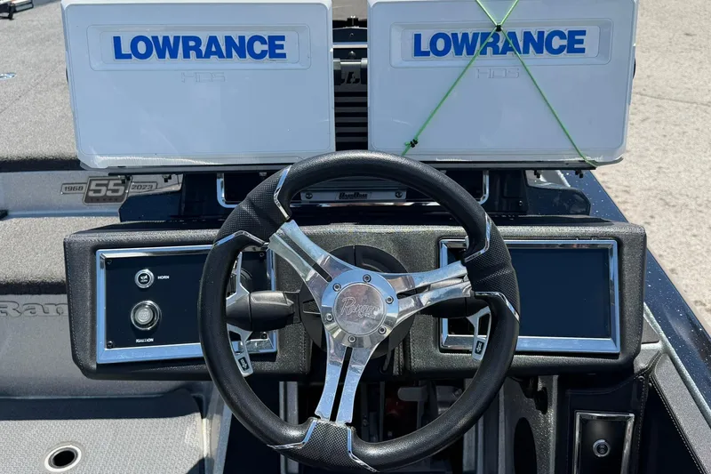 Slide: The Image of 2023 Ranger Z521R boat dashboard with Lowrance displays and steering wheel. - 10