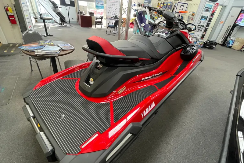 Slide: The Image of 2026 Yamaha WaveRunner VX Cruiser in showroom, red and black design, side view. - 5