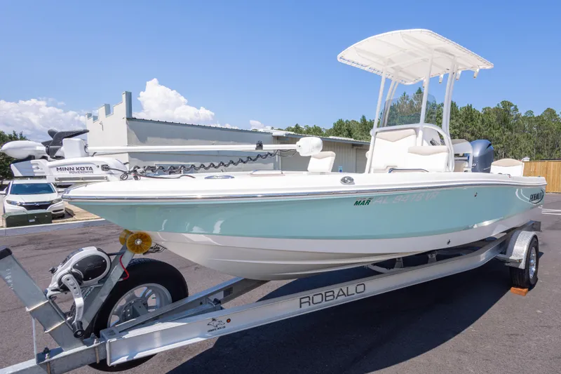 Slide: The Image of 2023 Robalo 206 Cayman boat on trailer, featuring Minn Kota trolling motor. - 7