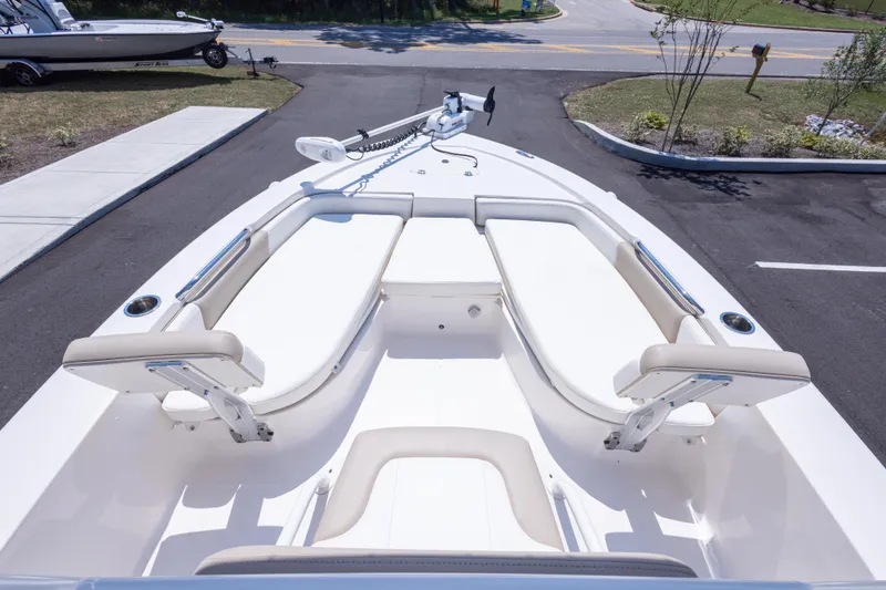 Slide: The Image of 2023 Robalo 206 Cayman boat interior with white seating and sleek design. - 17