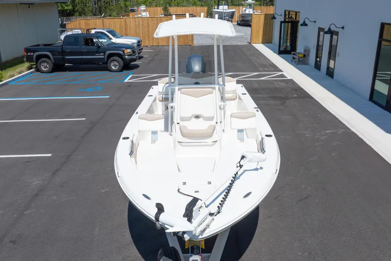 Slide: The Image of 2023 Robalo 206 Cayman boat parked in a lot, showcasing sleek design and modern features. - 39