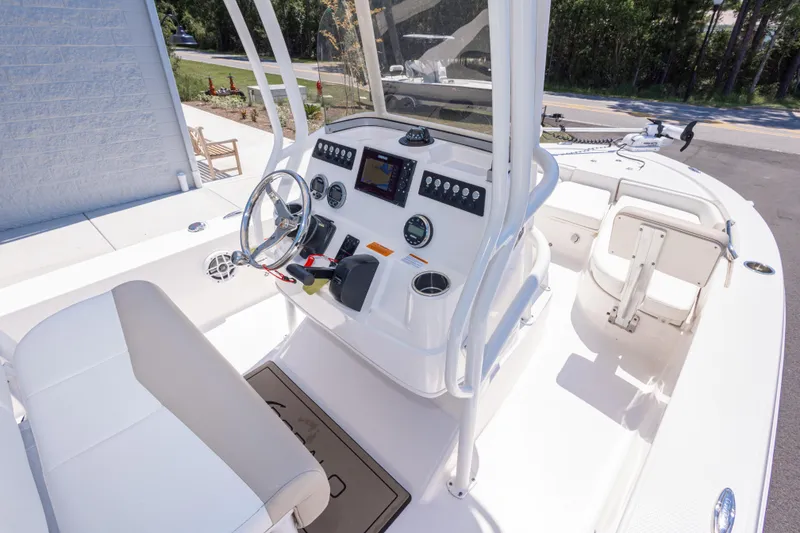 Slide: The Image of 2023 Robalo 206 Cayman boat interior with steering console and seating. - 14