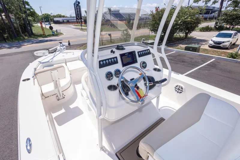 Slide: The Image of 2023 Robalo 206 Cayman boat interior with steering console and seating. - 13