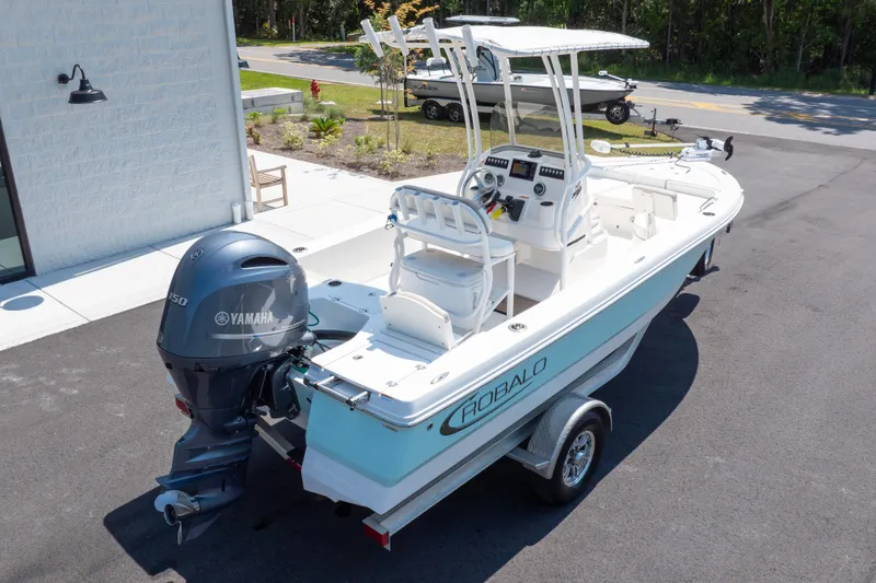 Slide: The Image of 2023 Robalo 206 Cayman boat with Yamaha engine, parked outdoors on a trailer. - 36