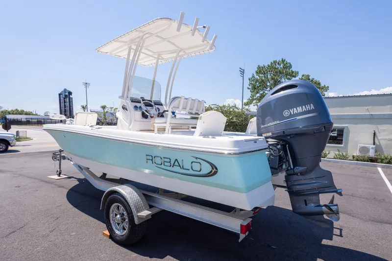 Slide: The Image of 2023 Robalo 206 Cayman boat with Yamaha engine on trailer, parked outdoors. - 5