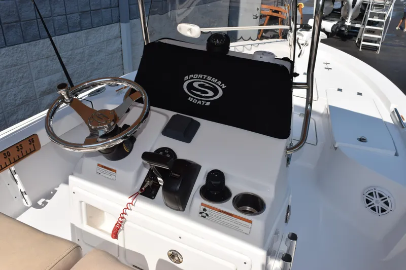 Slide: The Image of 2019 Sportsman Masters 207 Bay Boat helm with steering wheel and controls. - 7