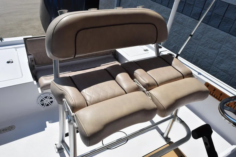 Slide: The Image of 2019 Sportsman Masters 207 Bay Boat with tan cushioned seating and stainless steel frame. - 8