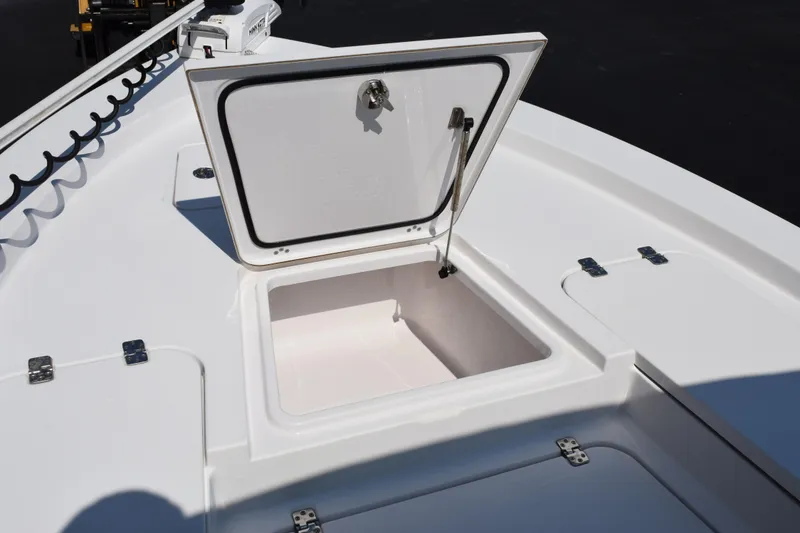 Slide: The Image of 2019 Sportsman Masters 207 Bay Boat with open storage compartment on deck. - 15