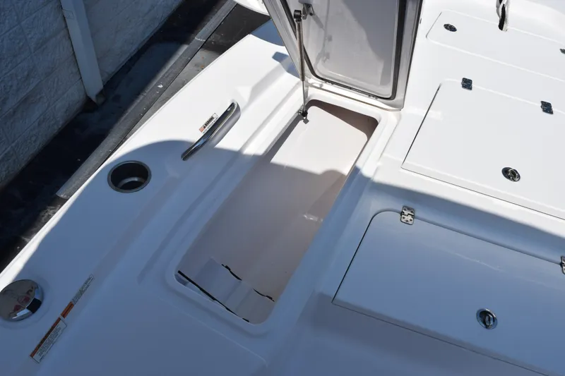 Slide: The Image of 2019 Sportsman Masters 207 Bay Boat deck with open storage compartments. - 13