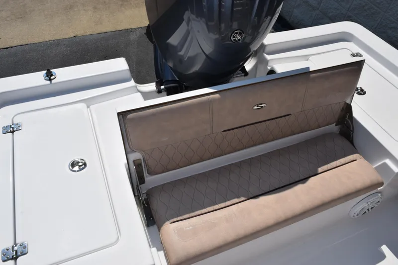Slide: The Image of 2019 Sportsman Masters 207 Bay Boat with cushioned seating and motor detail. - 6