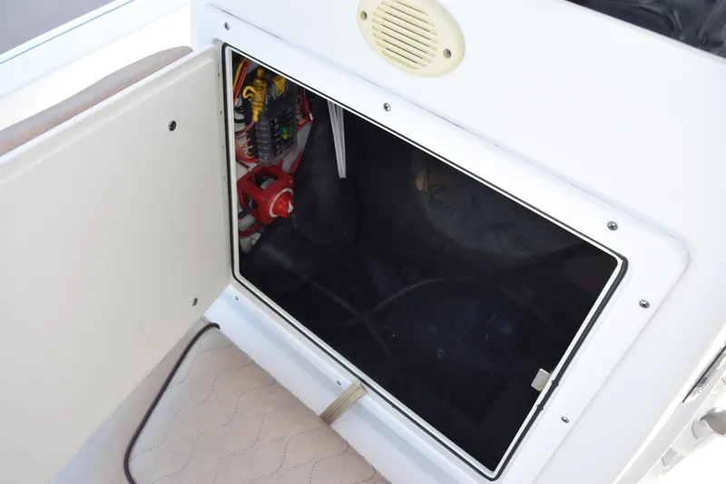 Slide: The Image of 2019 Sportsman Masters 207 Bay Boat electrical compartment with wiring and components. - 17