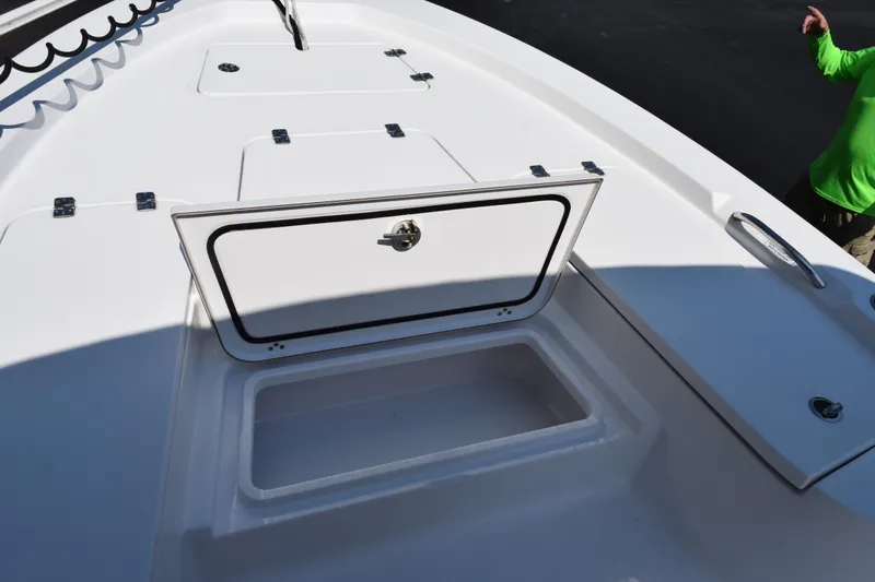 Slide: The Image of 2019 Sportsman Masters 207 Bay Boat open storage compartment on deck. - 16