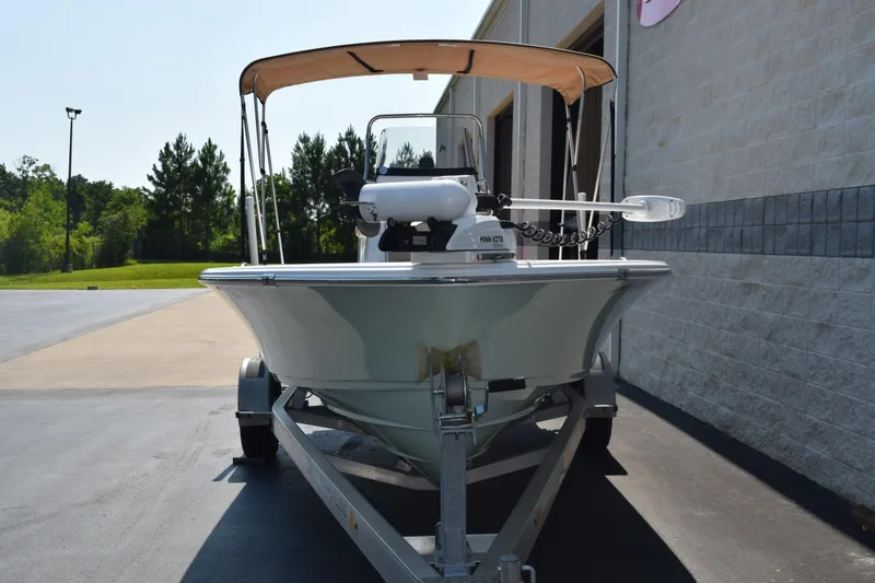 Slide: The Image of 2019 Sportsman Masters 207 Bay Boat on trailer, parked outdoors near a building. - 3