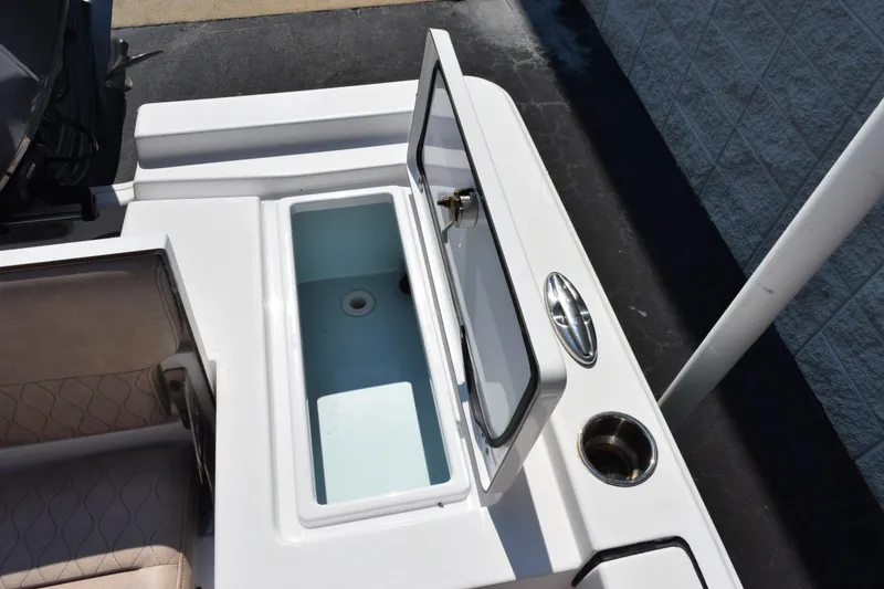 Slide: The Image of Open storage compartment on a 2019 Sportsman Masters 207 Bay Boat. - 19
