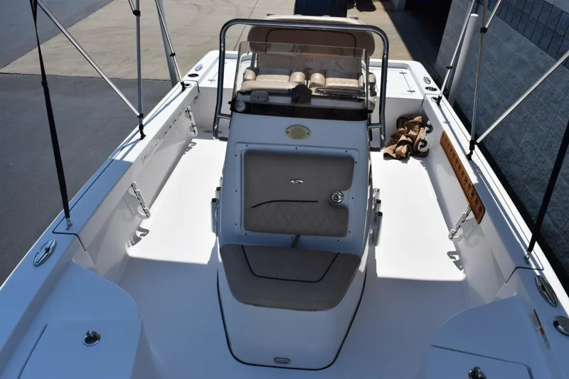 Slide: The Image of 2019 Sportsman Masters 207 Bay Boat interior with seating and storage compartments. - 10