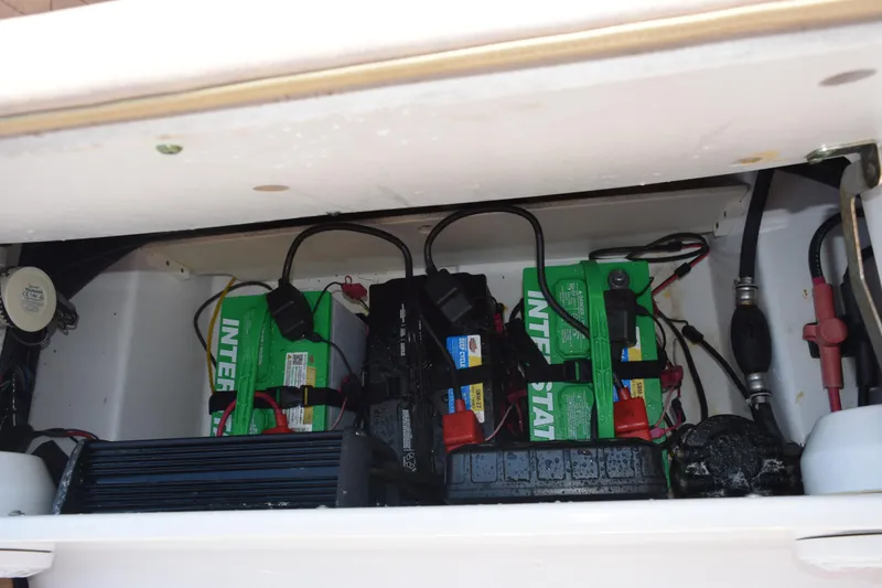 Slide: The Image of Battery compartment of a 2019 Sportsman Masters 207 Bay Boat with Interstate batteries. - 21