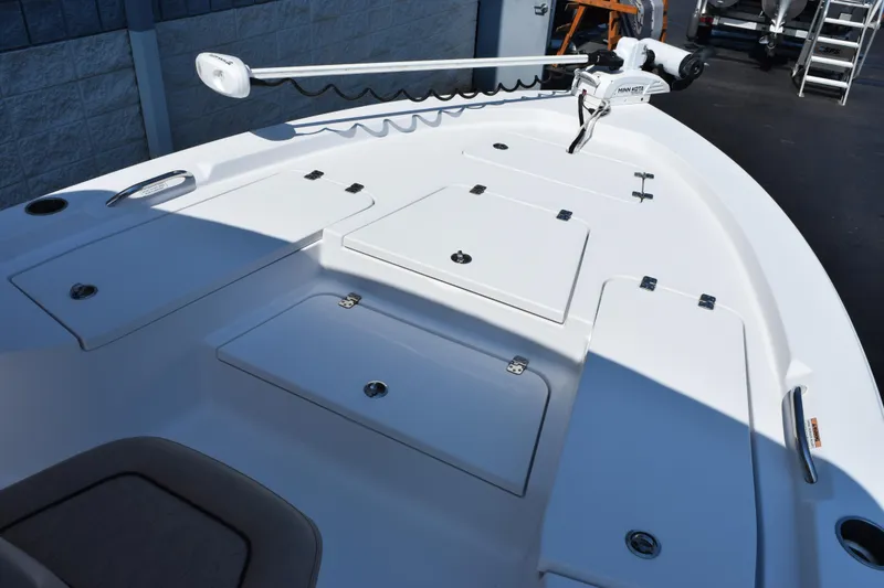 Slide: The Image of 2019 Sportsman Masters 207 Bay Boat deck with storage compartments and trolling motor. - 9
