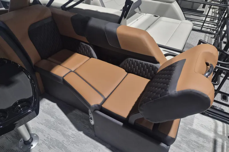 Slide: The Image of Luxurious seating in the 2026 Sylvan L3 SLZ boat, featuring brown and black upholstery. - 24