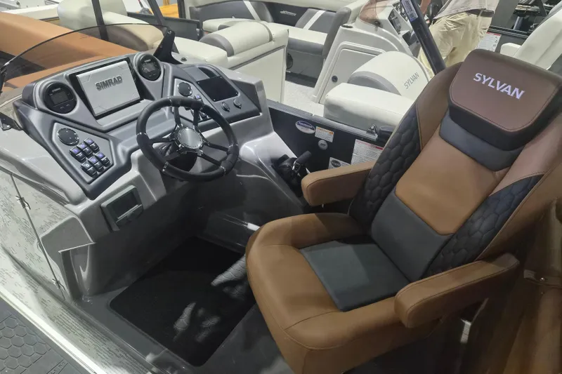 Slide: The Image of 2026 Sylvan L3 SLZ boat interior with modern dashboard and luxurious seating. - 13