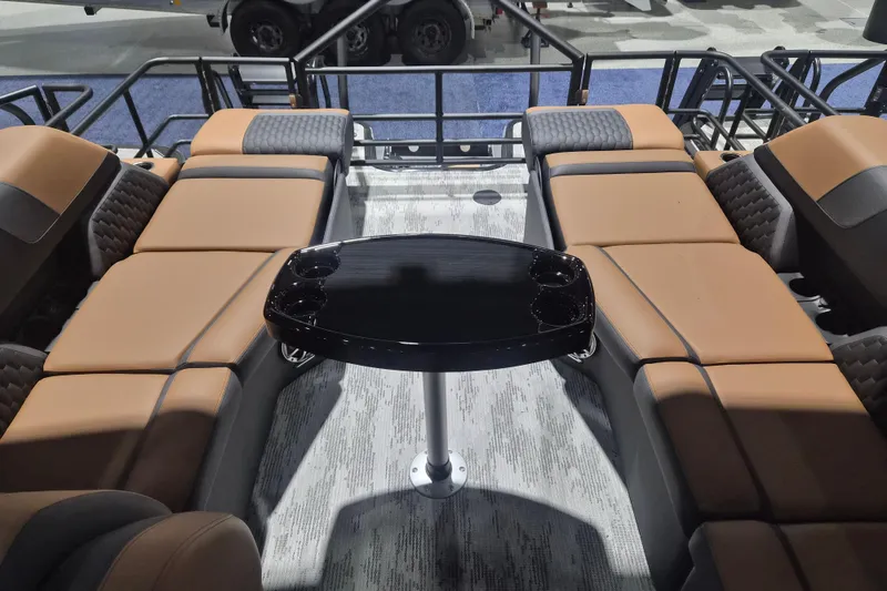 Slide: The Image of Luxurious interior of 2026 Sylvan L3 SLZ pontoon boat with plush seating and sleek table. - 18