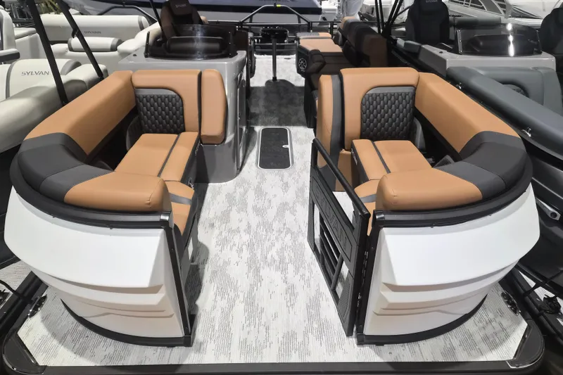 The Image of 2026 Sylvan L3 SLZ pontoon boat interior with luxurious tan and black seating. - 1