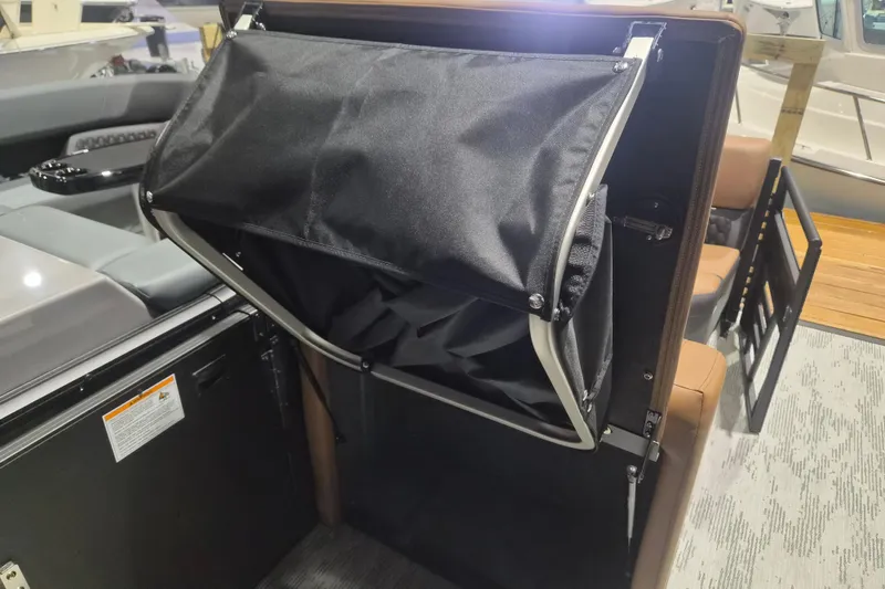 Slide: The Image of 2026 Sylvan L3 SLZ boat interior with foldable storage compartment. - 12