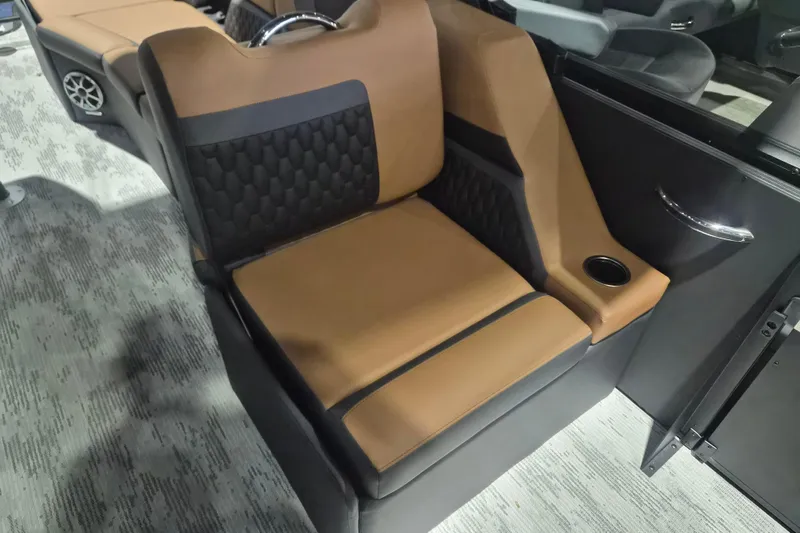 Slide: The Image of Luxurious seating in the 2026 Sylvan L3 SLZ boat, featuring brown and black upholstery. - 10
