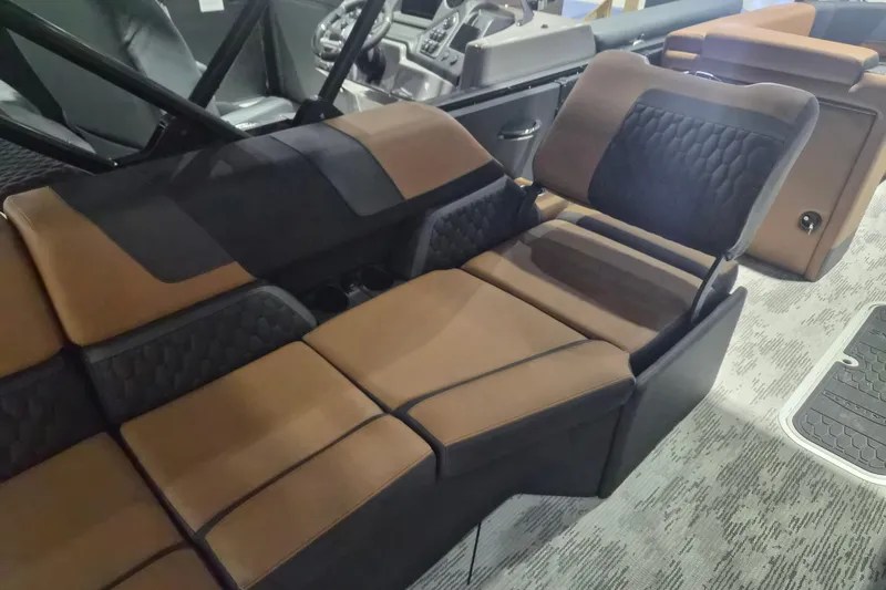 Slide: The Image of Luxurious interior seating of 2026 Sylvan L3 SLZ boat with brown and black upholstery. - 17
