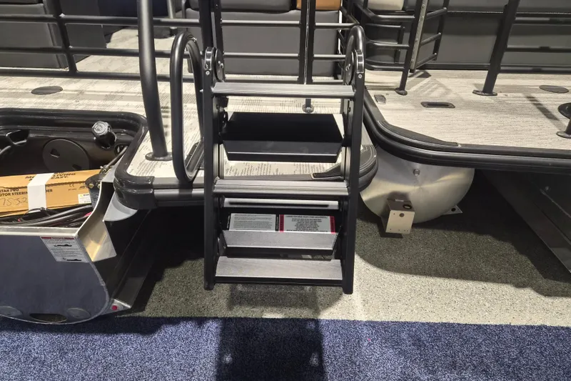 Slide: The Image of 2026 Sylvan L3 SLZ pontoon boat with boarding ladder and storage compartment. - 26