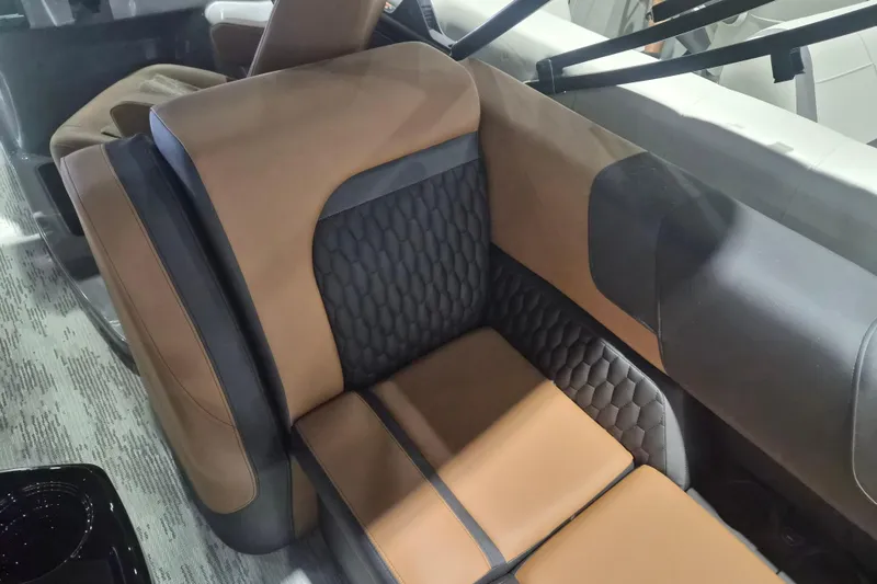 Slide: The Image of Luxurious interior seating of 2026 Sylvan L3 SLZ with brown and black upholstery. - 19