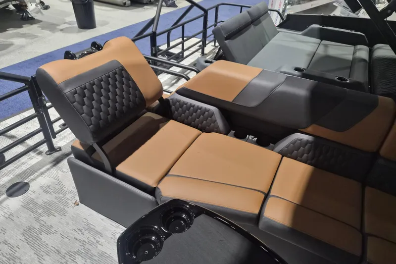 Slide: The Image of Luxurious seating in 2026 Sylvan L3 SLZ boat, featuring brown and black upholstery. - 22