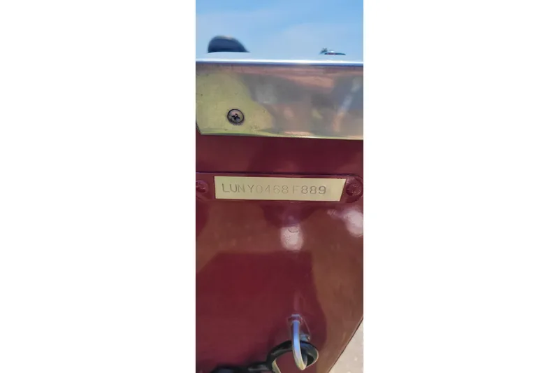 Slide: The Image of 1989 Lund 1600 Stinger boat with visible hull identification number. - 7