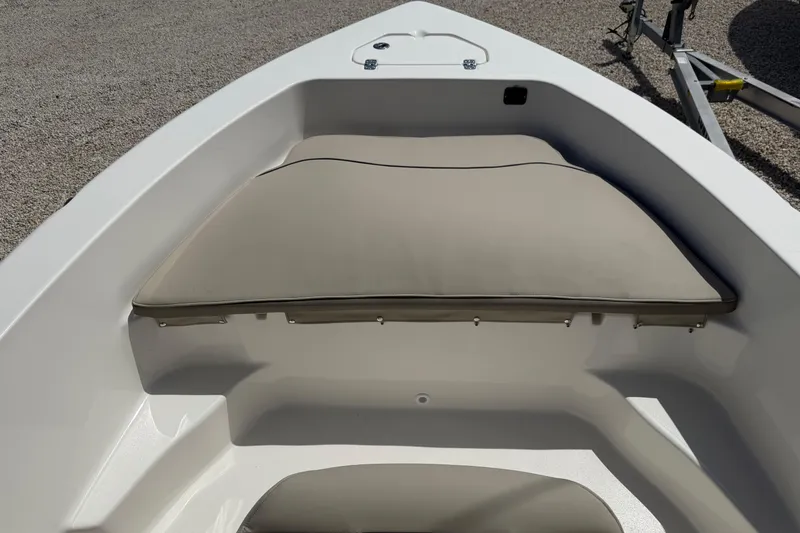 Slide: The Image of Bow seating area of 2026 Key West 179 FS boat with beige cushions. - 18