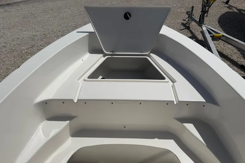 Slide: The Image of 2026 Key West 179 FS boat interior with open storage compartment. - 20