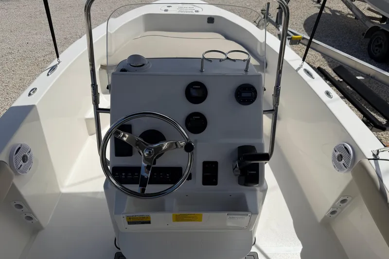 Slide: The Image of 2026 Key West 179 FS boat console with steering wheel and gauges. - 16