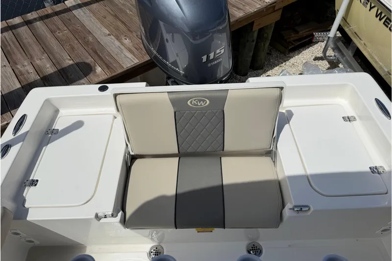 Slide: The Image of 2026 Key West 179 FS boat with Yamaha 115 engine, featuring cushioned seating. - 10