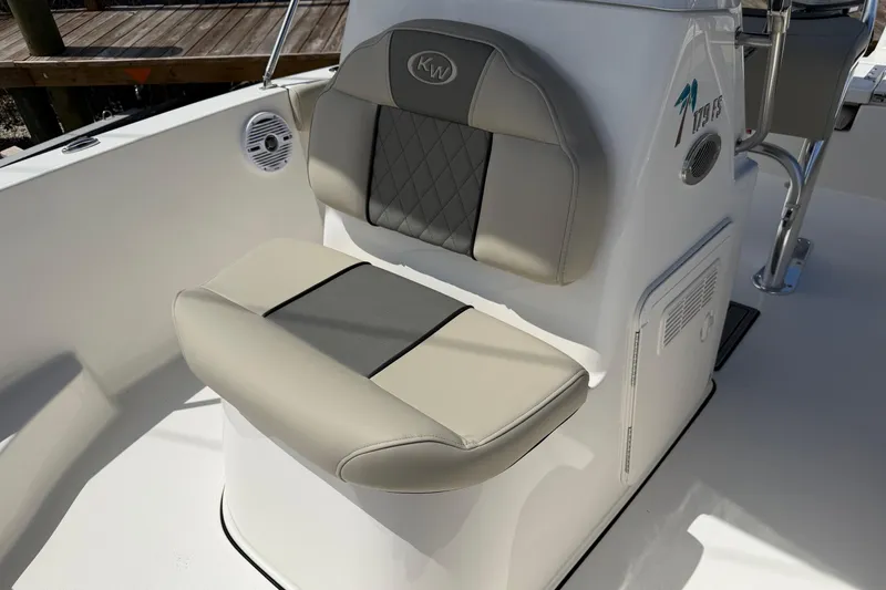 Slide: The Image of 2026 Key West 179 FS boat seat with gray and beige upholstery. - 23