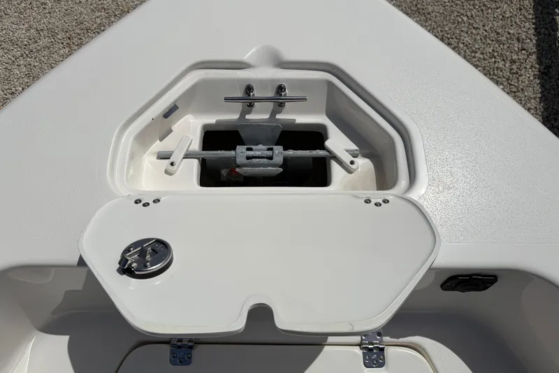 Slide: The Image of Anchor storage compartment on 2026 Key West 179 FS boat, featuring a secure latch system. - 21