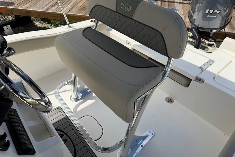 Slide: The Image of 2026 Key West 179 FS boat interior with steering wheel and seating. - 15