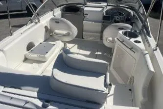 Slide: The Image of 2008 Maxum 2100 SC3 boat interior with white seating and steering console. - 7