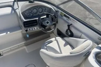 Slide: The Image of 2008 Maxum 2100 SC3 boat interior with steering wheel and dashboard controls. - 8