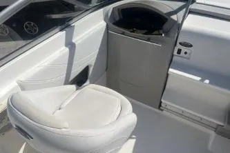 Slide: The Image of 2008 Maxum 2100 SC3 boat interior with white seating and dashboard. - 9