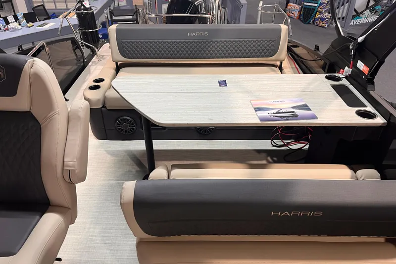 Slide: The Image of Luxurious interior of 2026 Harris Sunliner 250 pontoon boat with comfortable seating and table. - 4